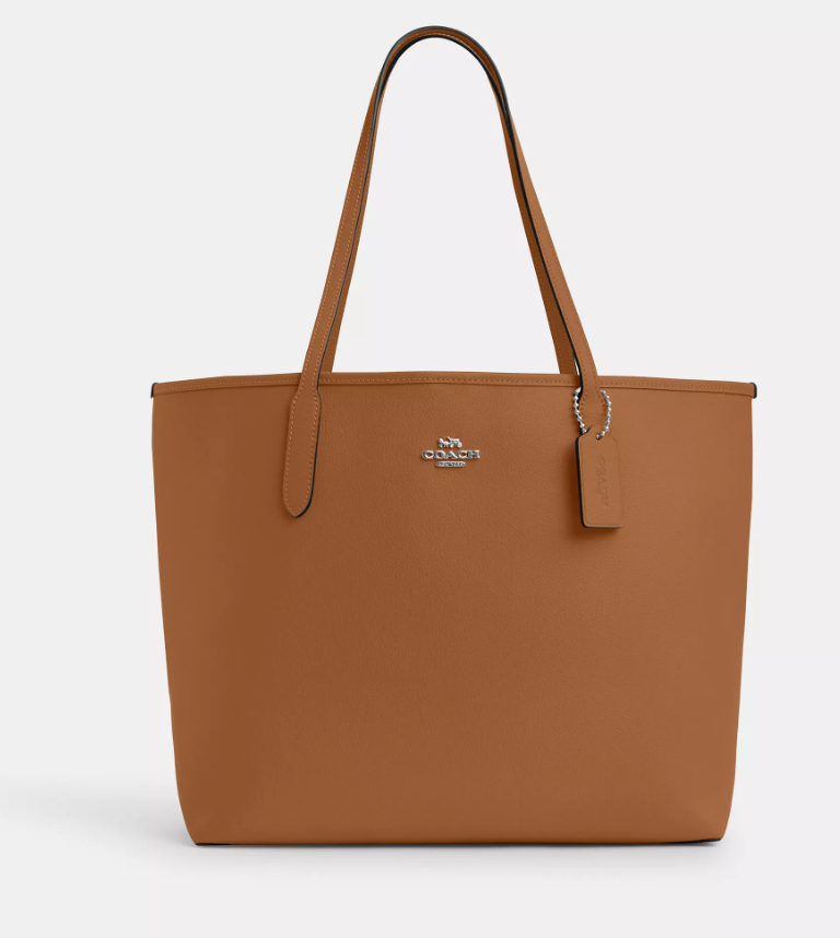 Front view of a brown coach tote bag 2