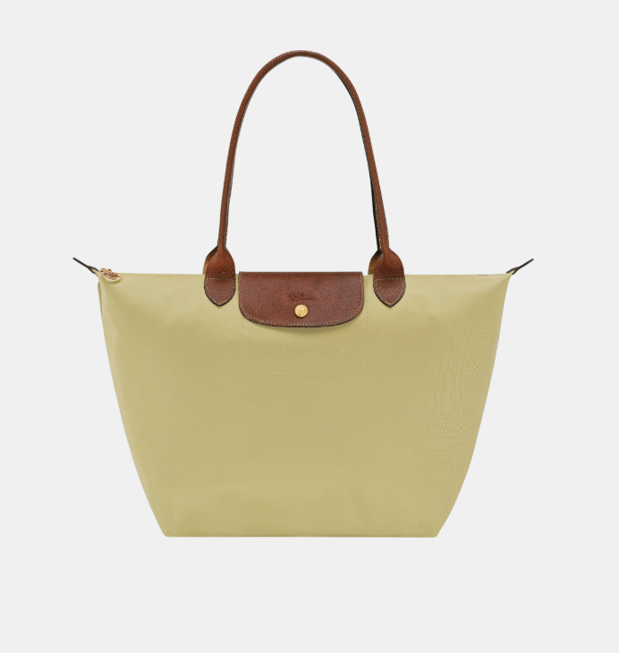 Front view of a lemon color longchamp le pliage tote bag